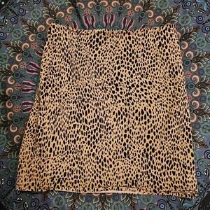 Brandy Melville Women's Black and Tan Cheetah Print Skirt